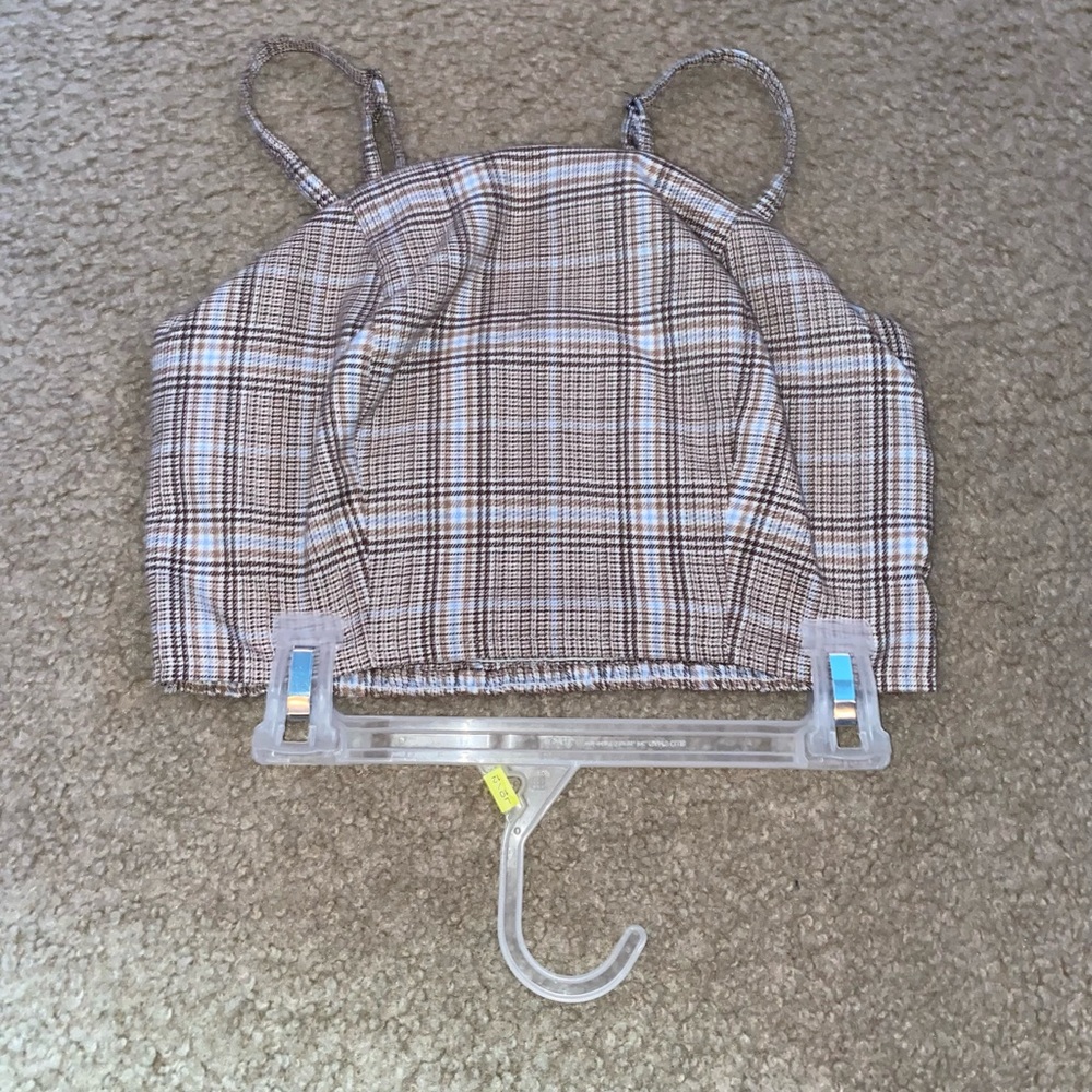 This is a brown light brown and blue, striped spaghetti strap crop top